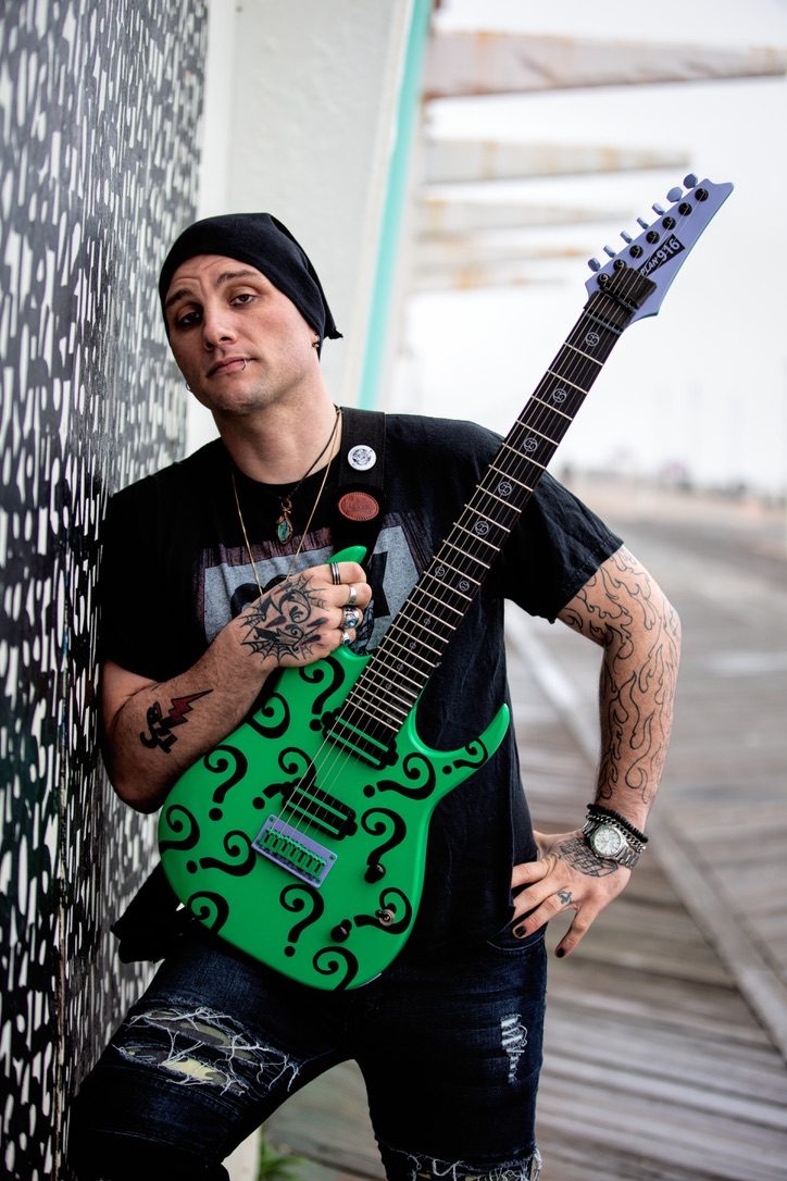 The Riddler: green seven-string guitar with a question-mark finish, a custom 916 Pickups build