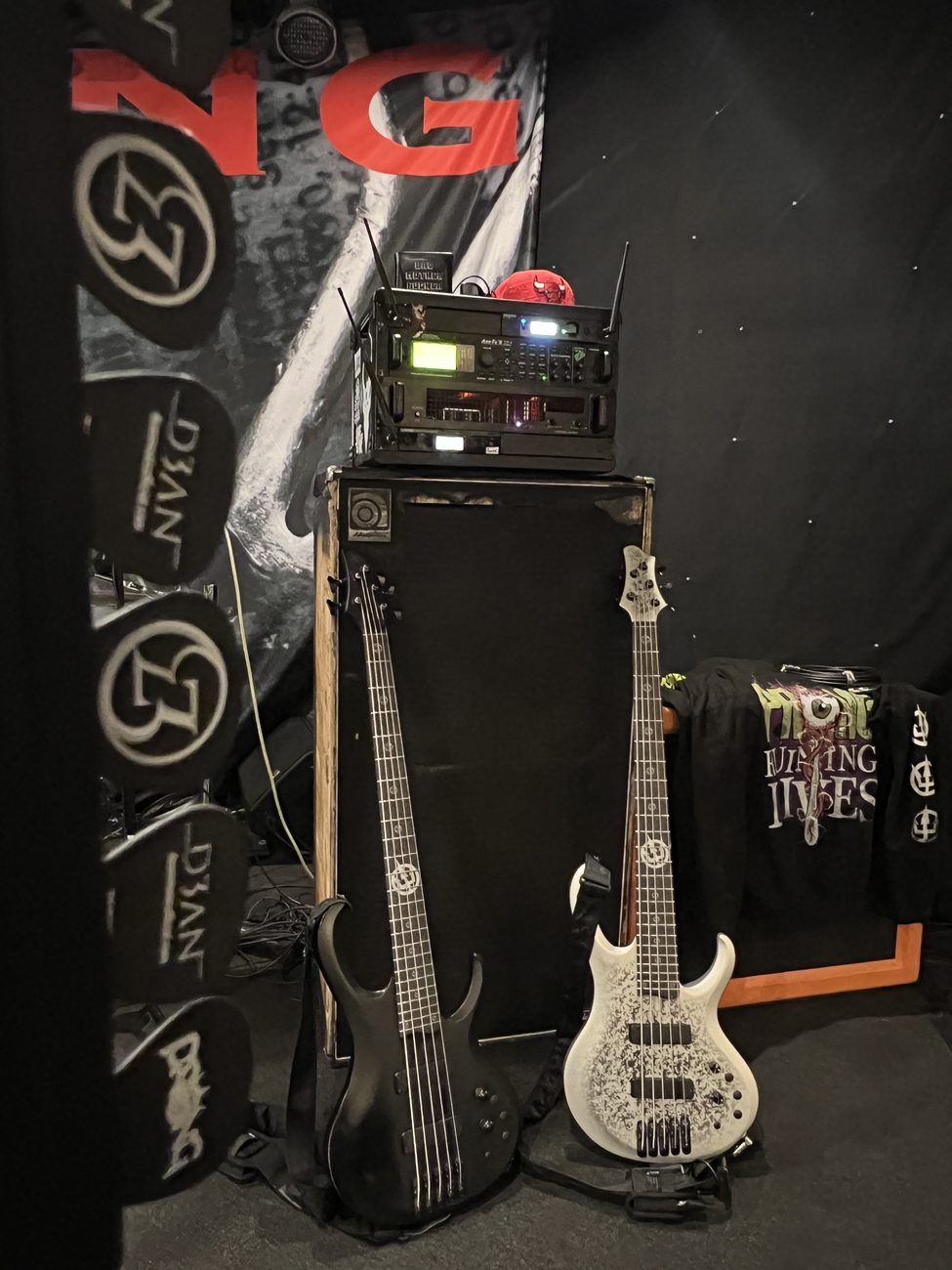 Touring bass rig with an Ampeg 8x10 and two BTB five-strings